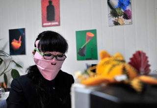 Illustration for article titled China's Radiation Masks Sure Make Computer Work Interesting